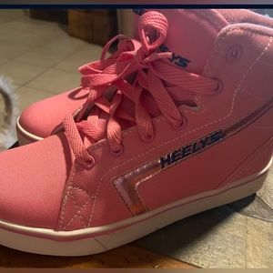Brand New /Never Worn Pink high rise HEELYS SIZE 6youth.Fit 7 in women’s size